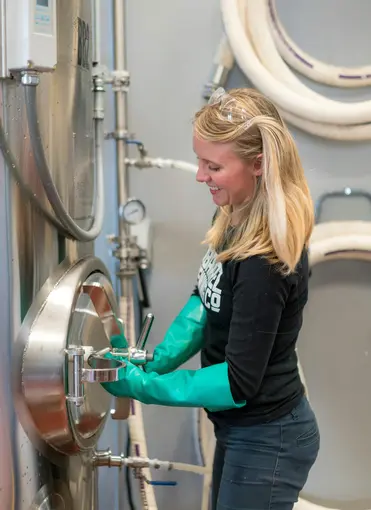 Female brewery employee working