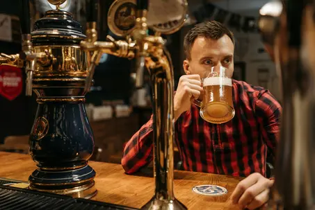 Man enjoying beer at the bar