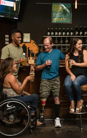 People drinking beer at a bar